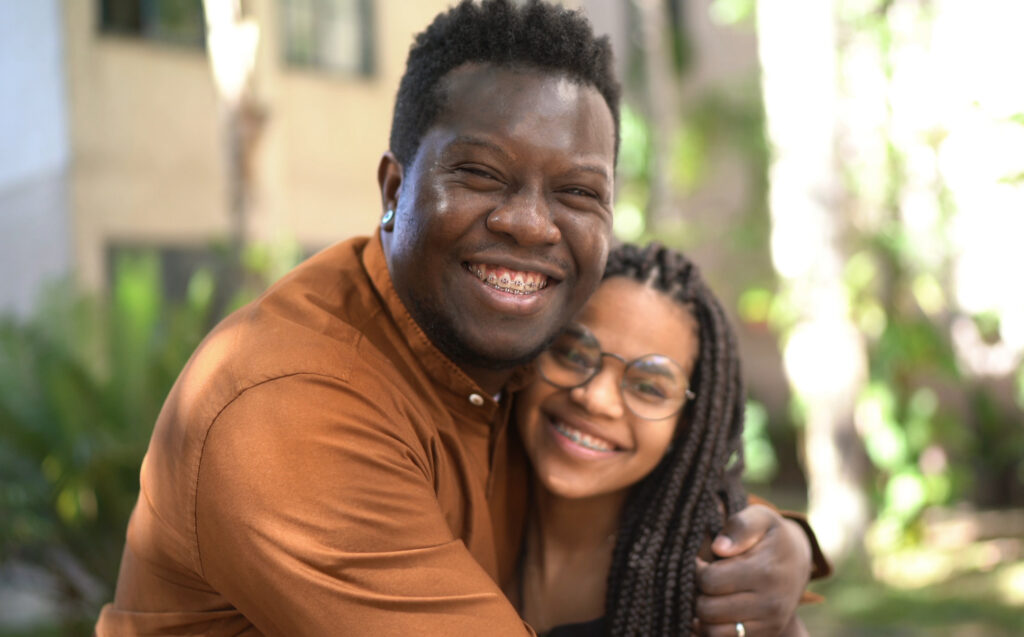 Portrait of father and daughter embracing outside